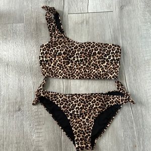 Two piece matching set!!Never worn.One shoulder bikini top and matching bottom.